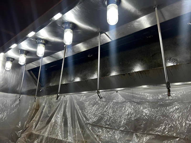 Clean commercial kitchen hood after steam cleaning in Laurel