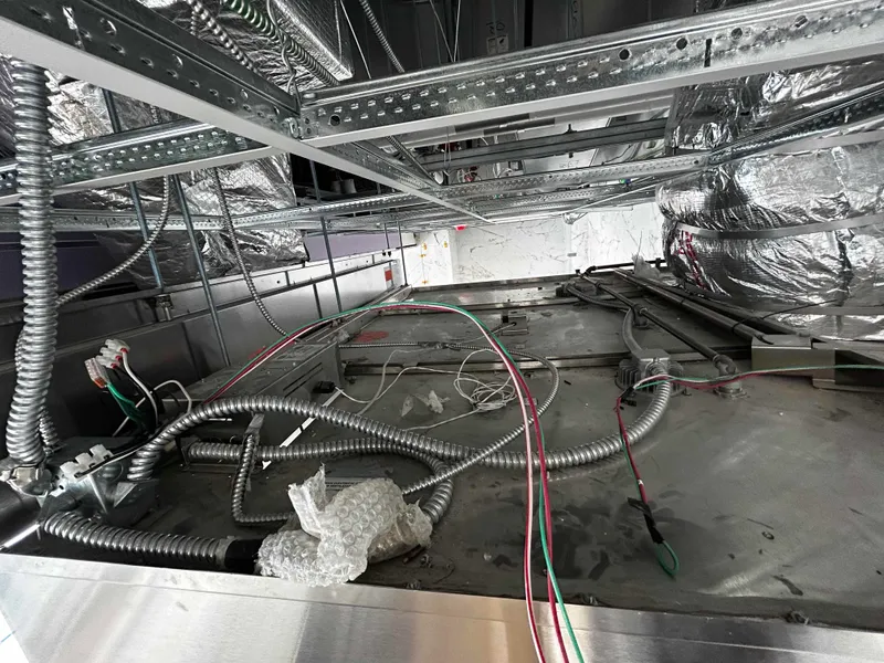 Certified Commercial Exhaust Safety Technician performing compliance verification